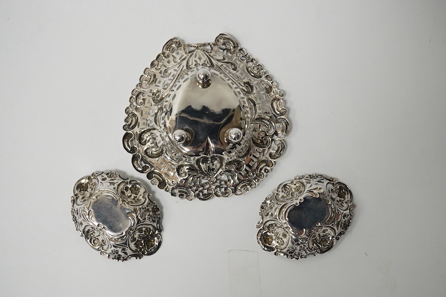 An embossed white metal bon bon dish (a.f.) 11cm and a pair of smaller late Victorian silver bon bon dishes. Condition - poor and good